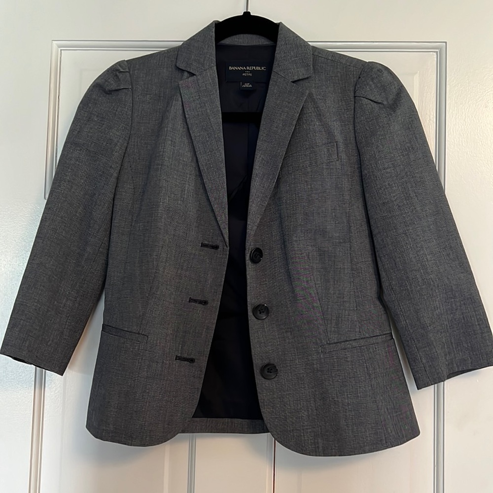 Grayish blue cropped blazer with a puffed shoulder